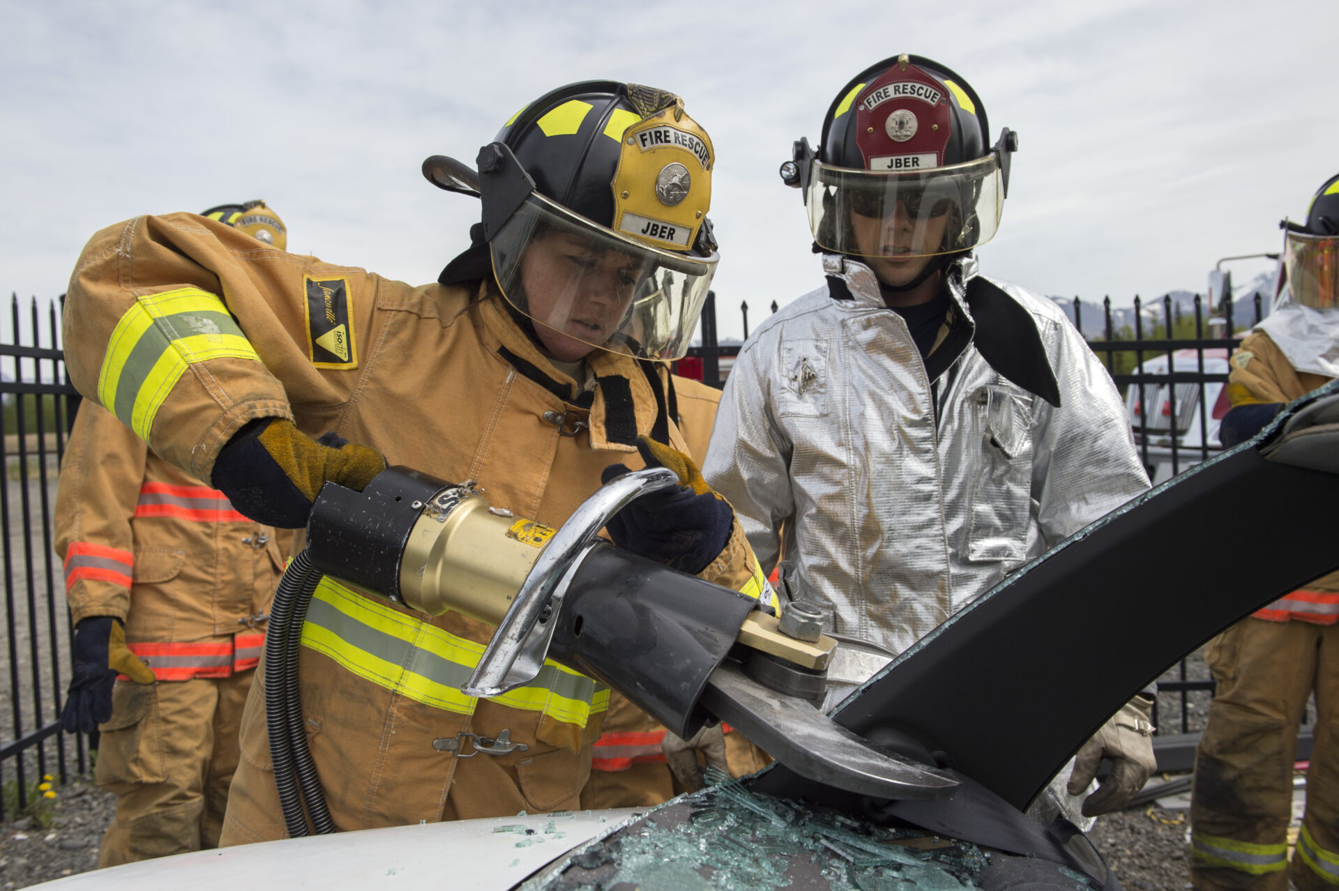 U.S. Air Force Academy cadet Katheryn New, left, a native of Mosca, Colo., operates a hydraulic rescue tool under the supervision of Troy Anthis, a firefighter assigned to the 673rd Civil Engineer Squadron, while conducting rescue training on Joint Base Elmendorf-Richardson, Alaska, May 20, 2015. The training provided the cadets, studying civil engineering, the opportunity to work with Airmen and noncommissioned officers in their field of choice. (U.S. Air Force photo/Alejandro Pena)